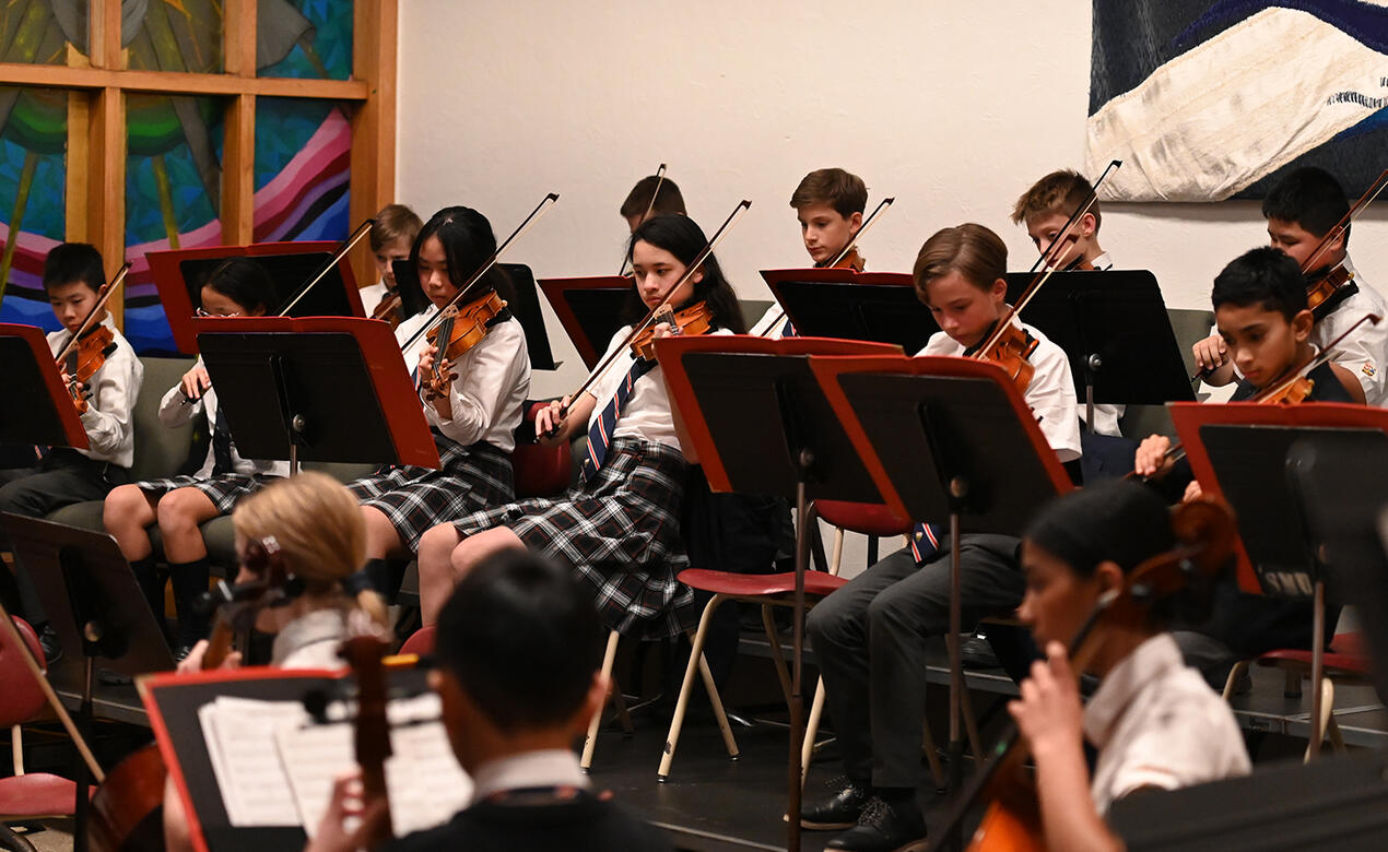 Middle School strings students perform