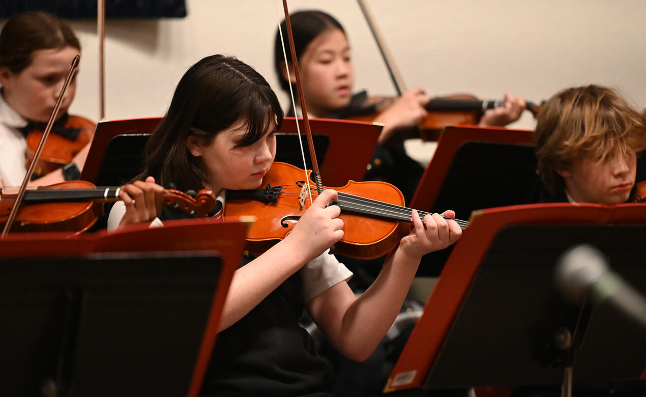 Middle School strings students perform