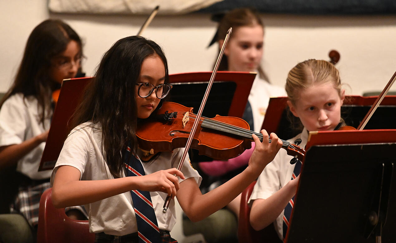 Middle School strings students perform