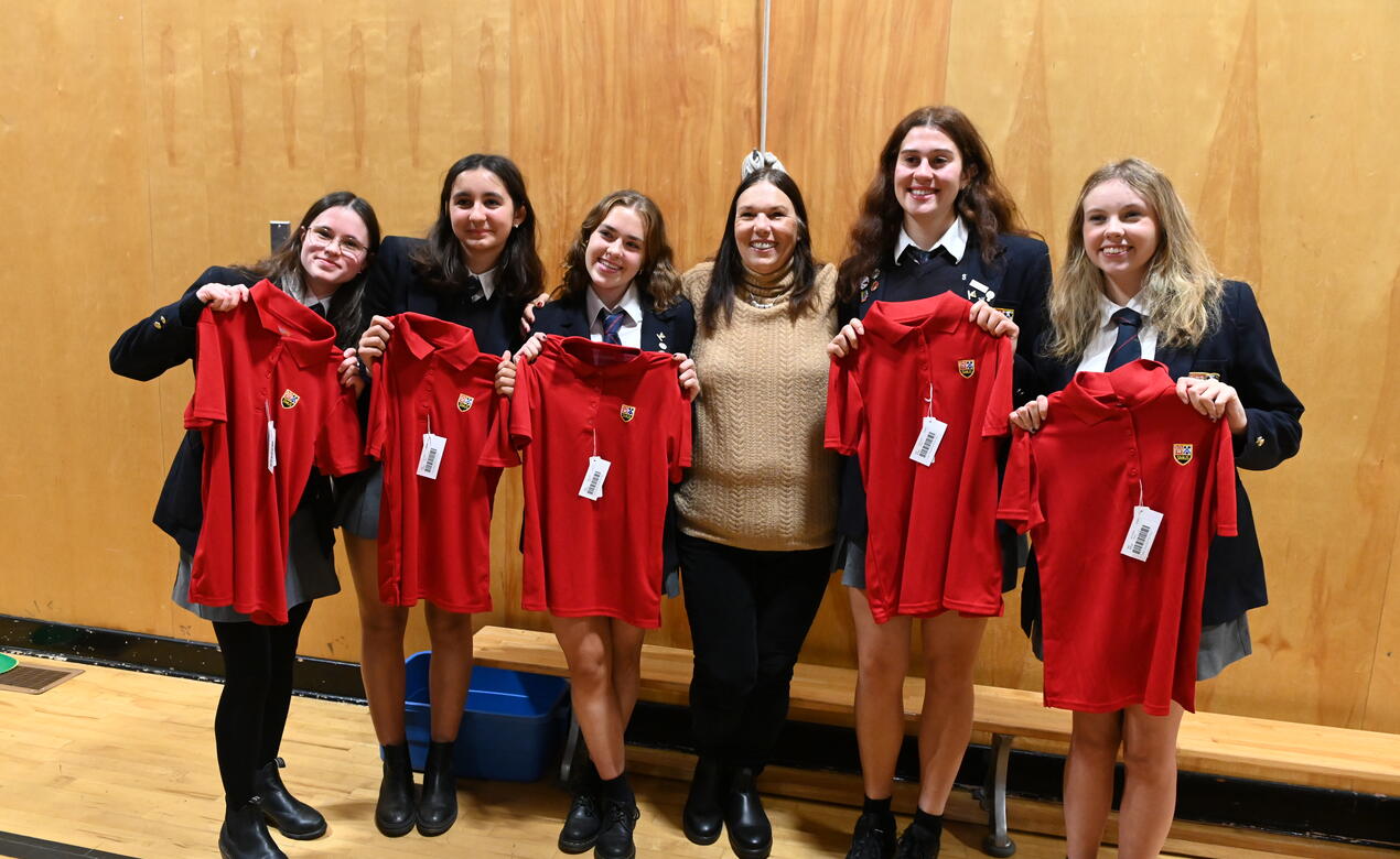 A group of Lifers pose with a former Junior School teacher 