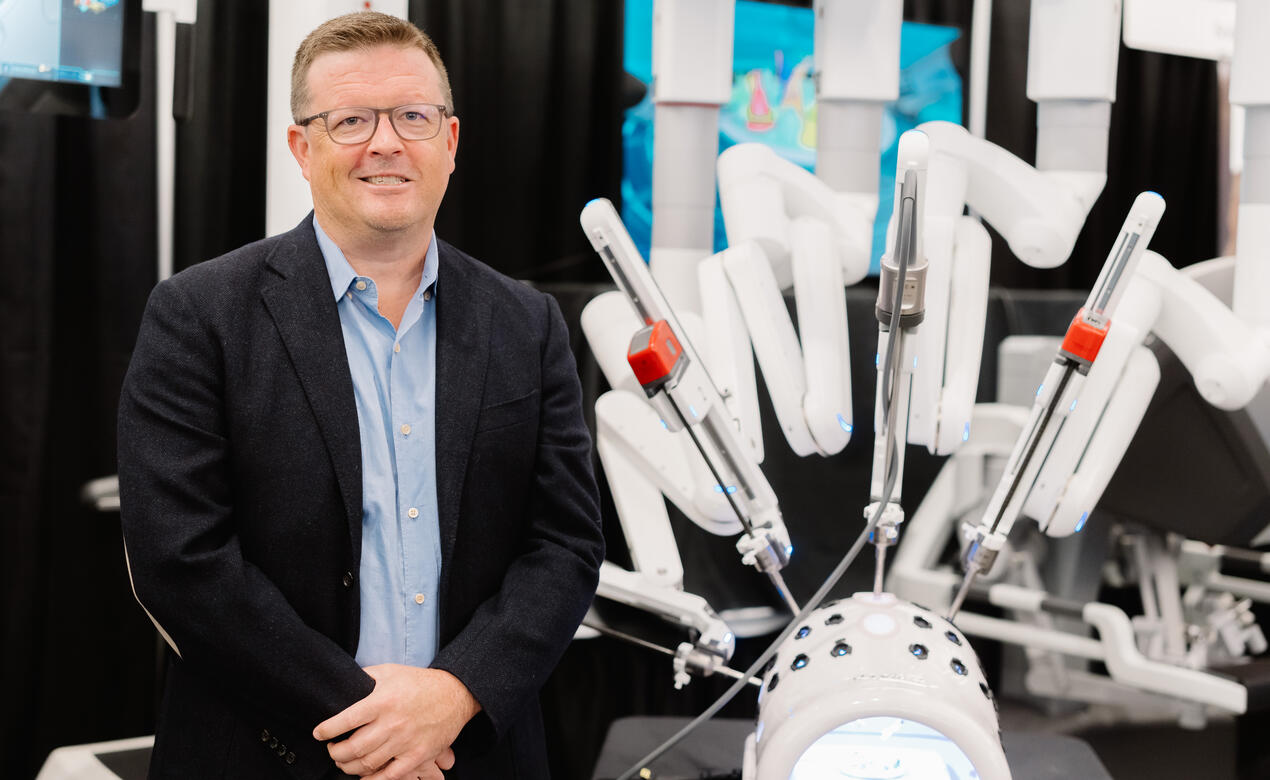 Dr. McCracken with Robot, courtesy of Victoria Hospitals Foundation