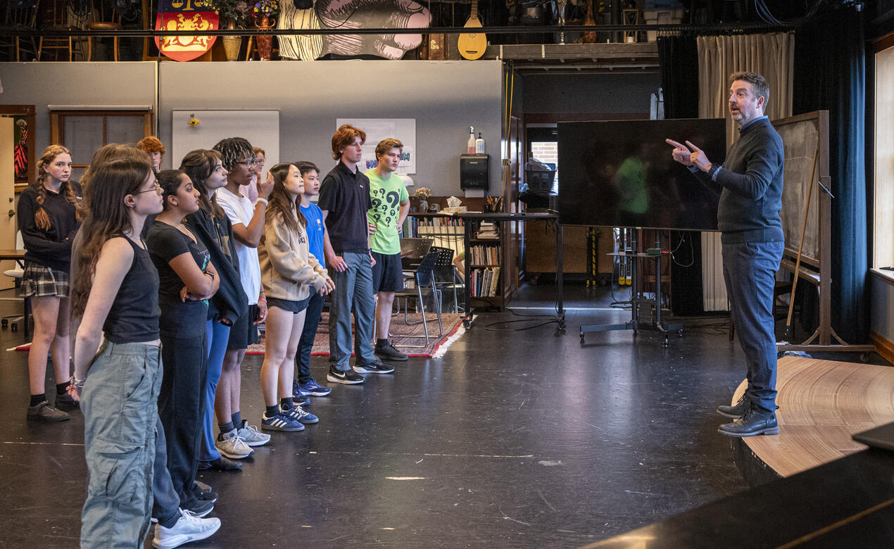 Teacher Morgan McLeod leads a group of SMUS students in a drama rehearsal.