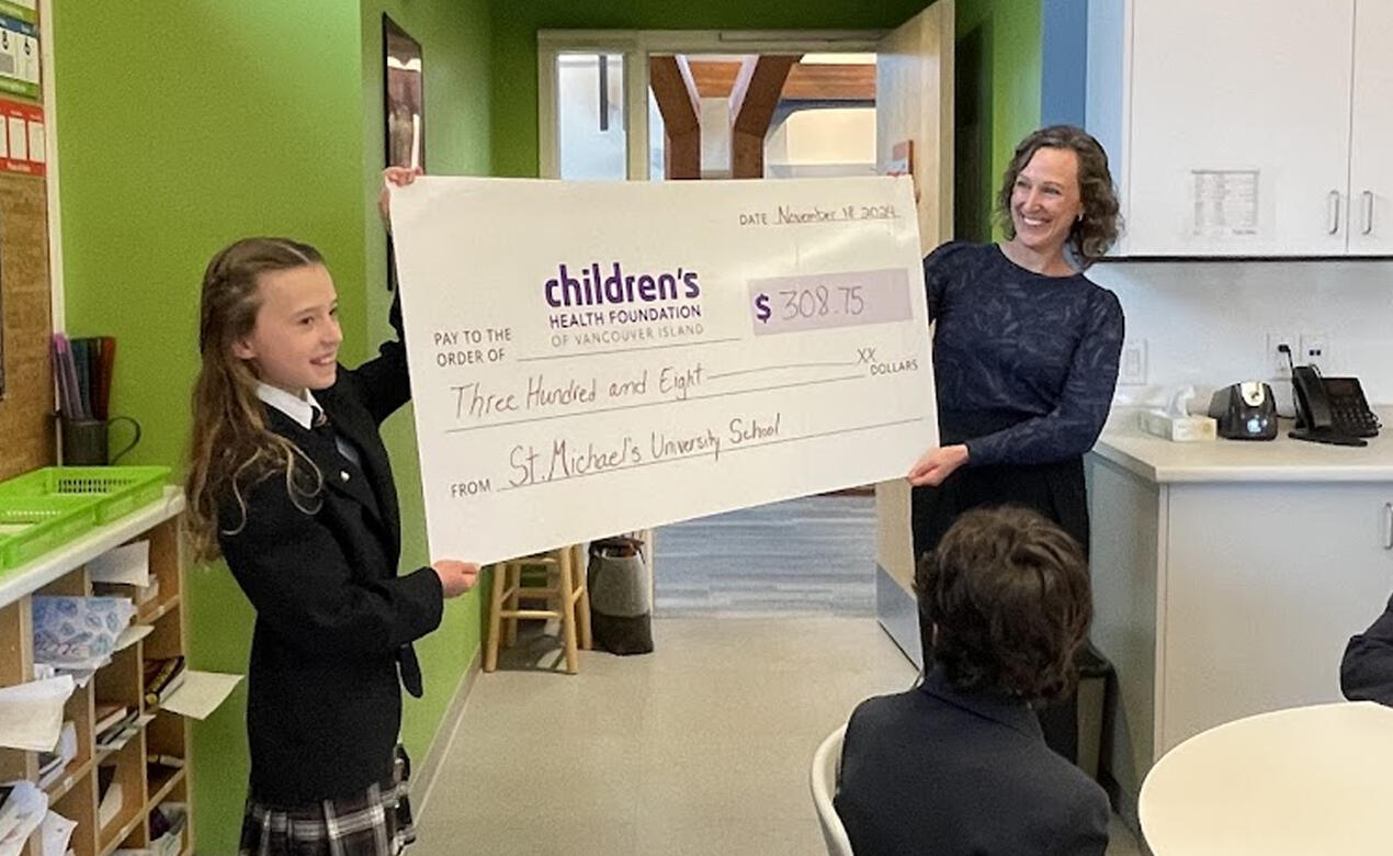 Grade 5's Zoey Cray holds the cheque in support of Jeneece Place.