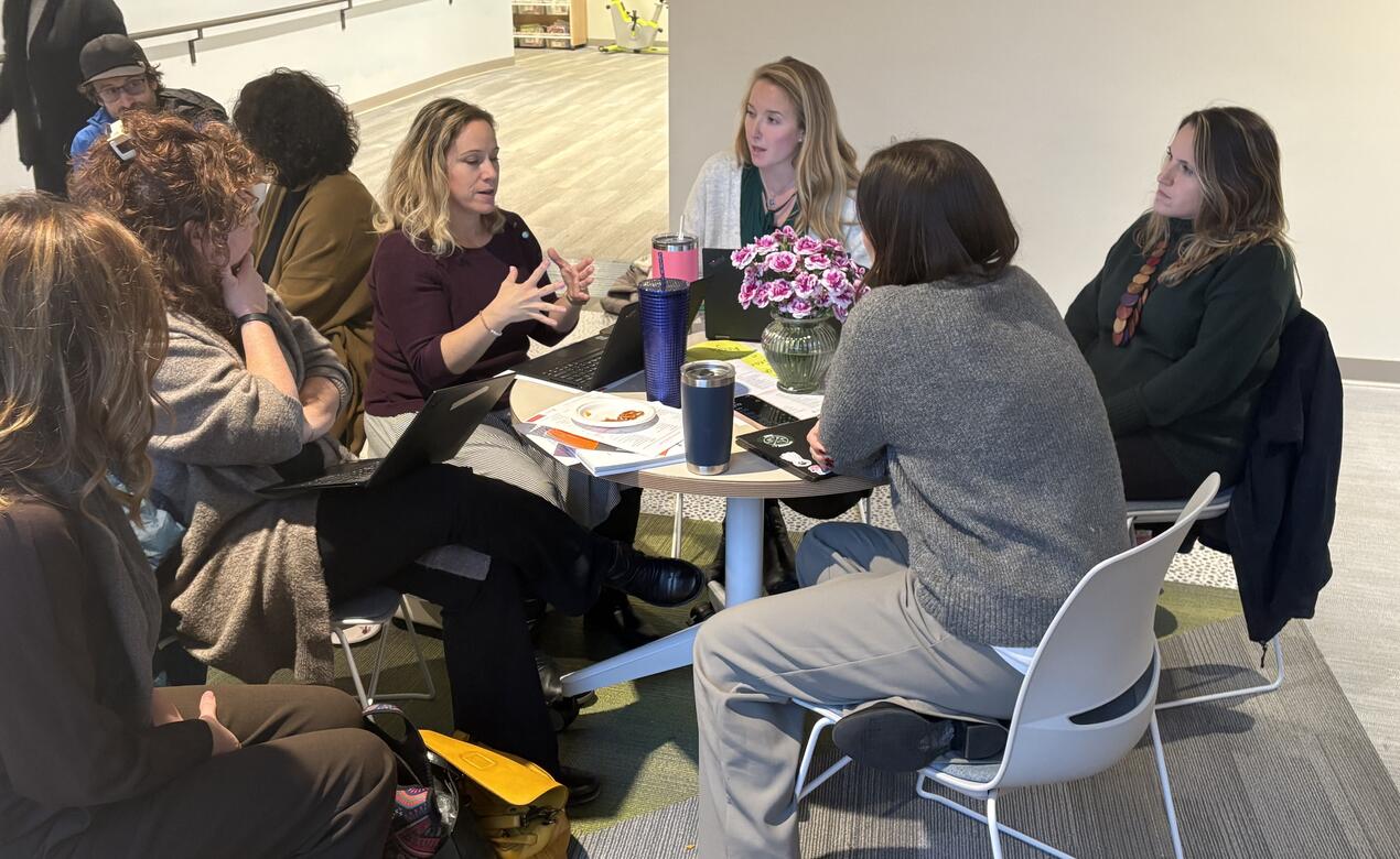 Junior School faculty gather, share and listen in small group discussions.