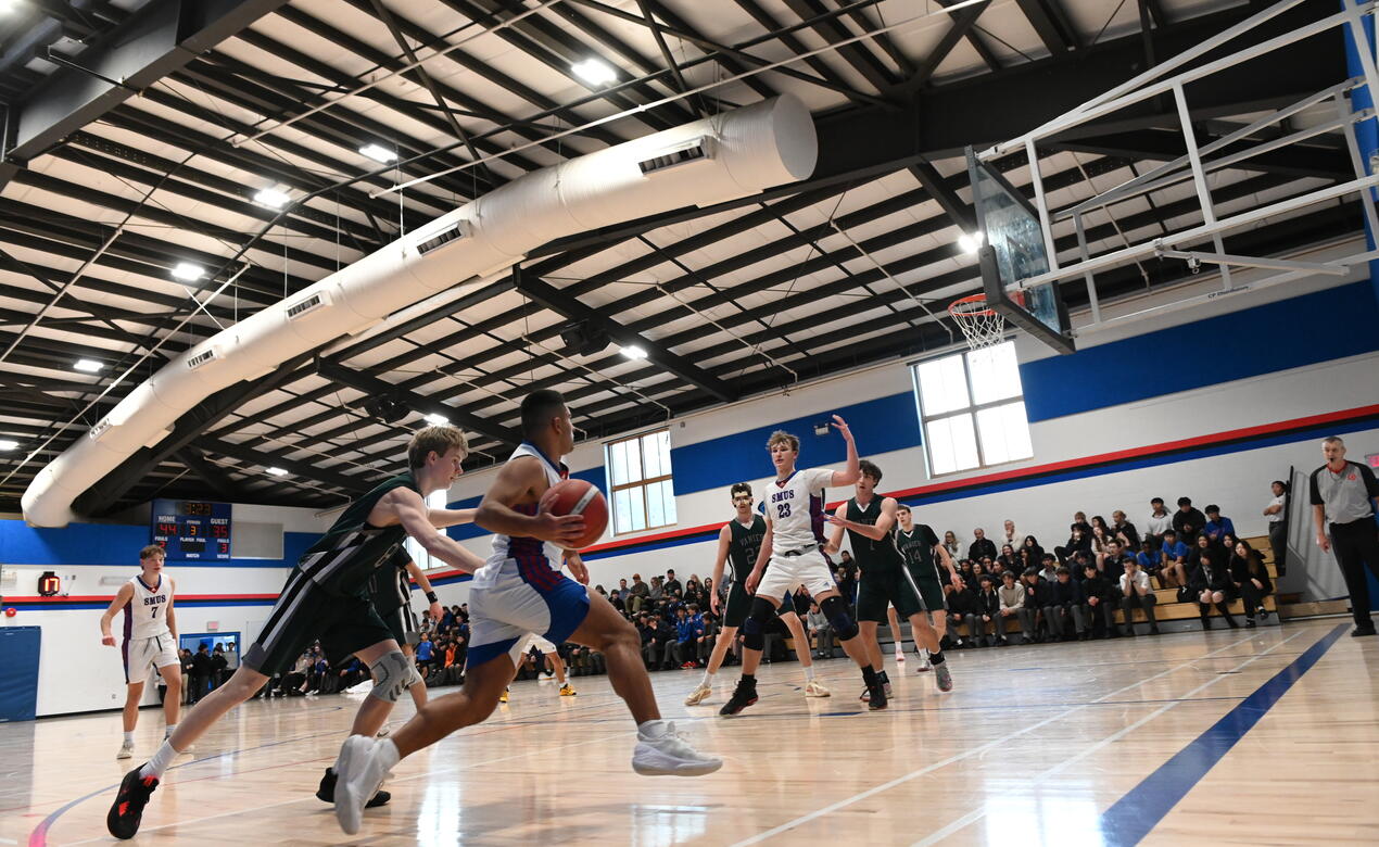 Action shot of the Senior Boys basketball team 