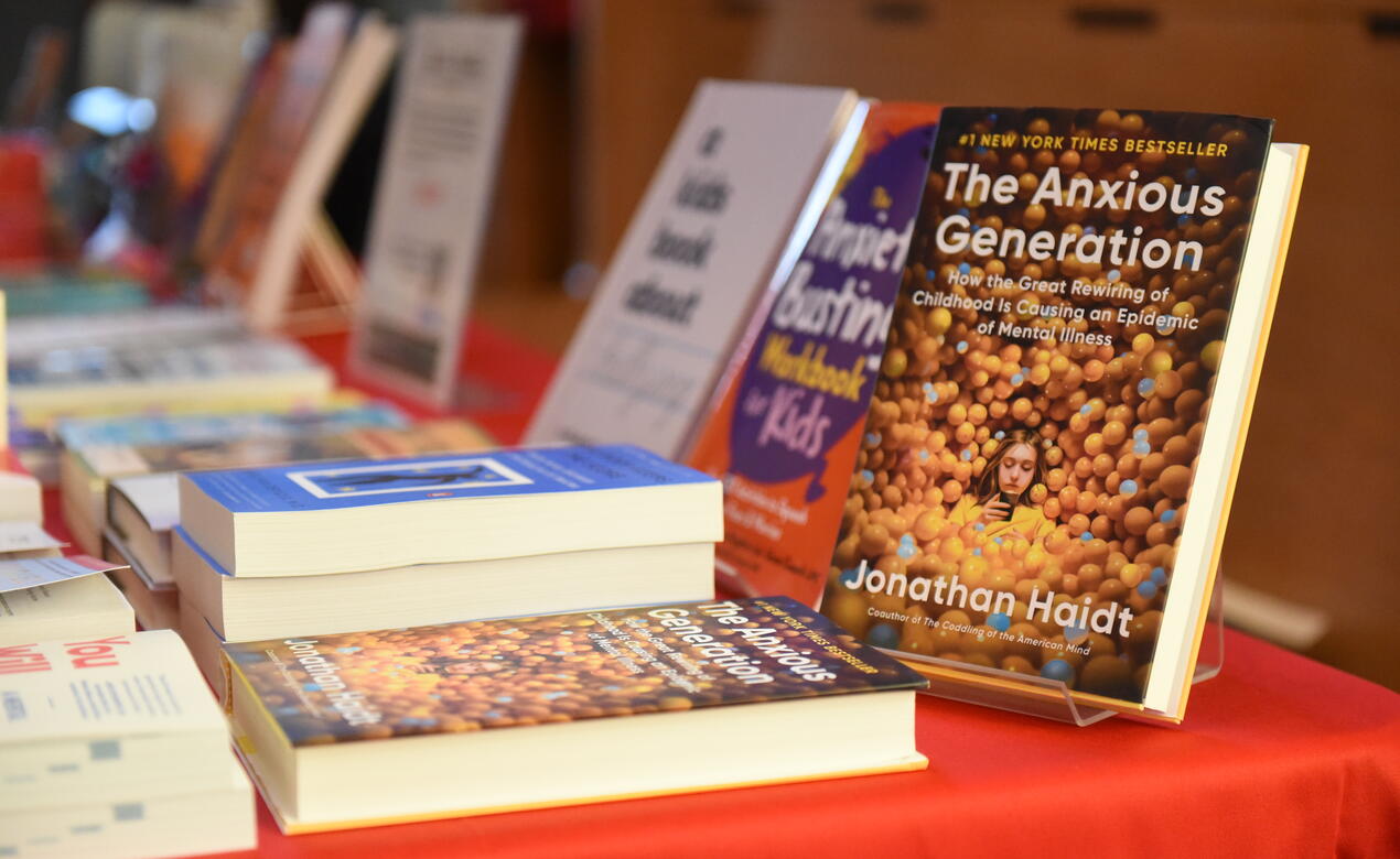Jonathan Haidt's bestseller book The Anxious Generation sits propped on a display table of books.