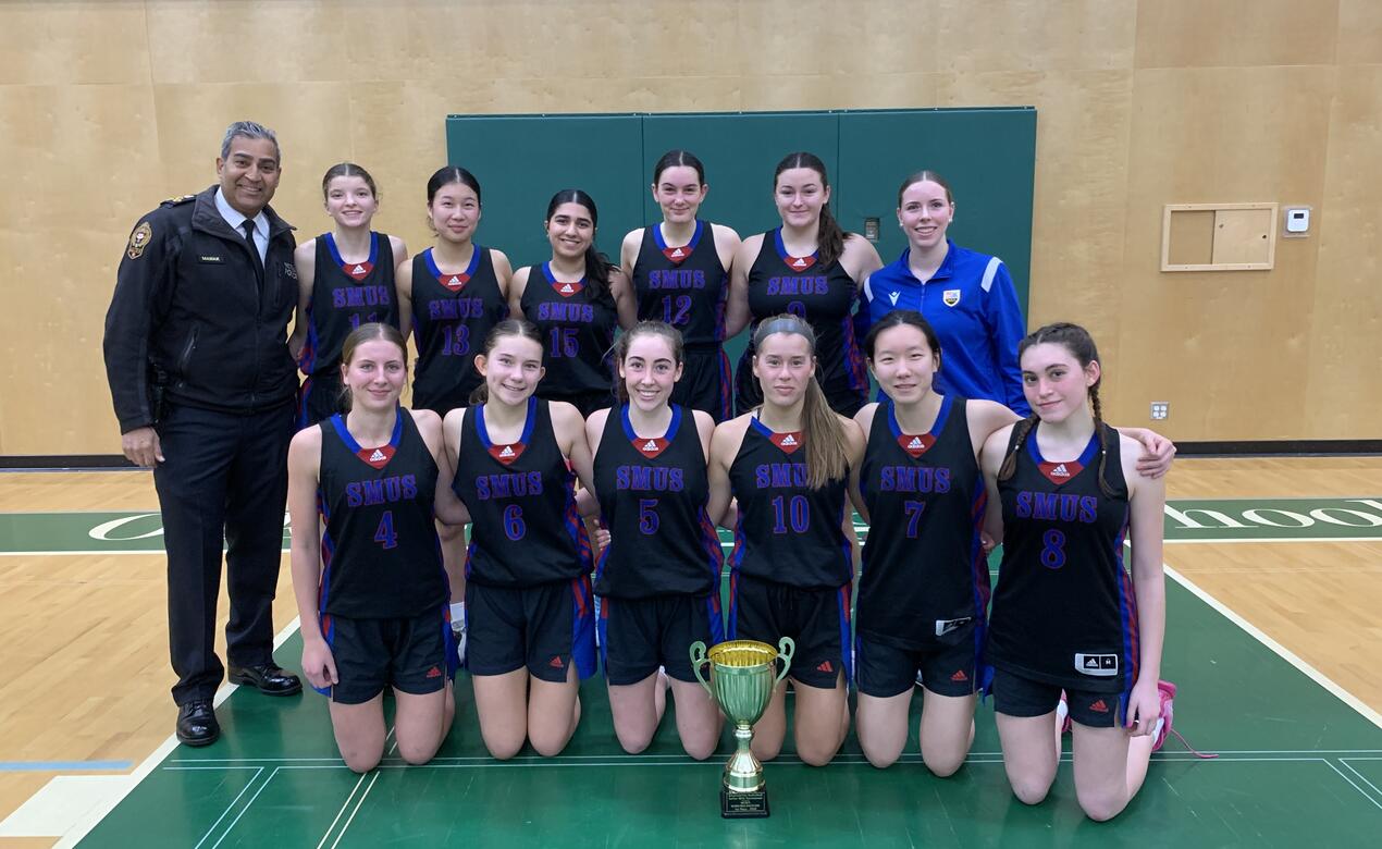 A team photo of the Senior Girls Basketball EmpowHER tournament Champions