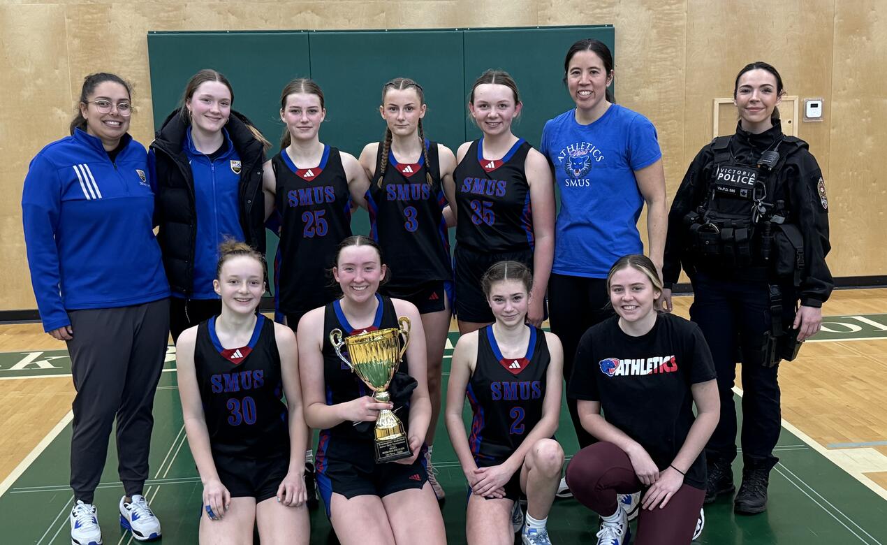 A team photo of the Junior Girls Basketball EmpowHER Tournament Champions