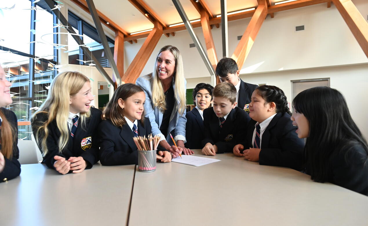 Becky Anderson with Grade 5 students in the atrium