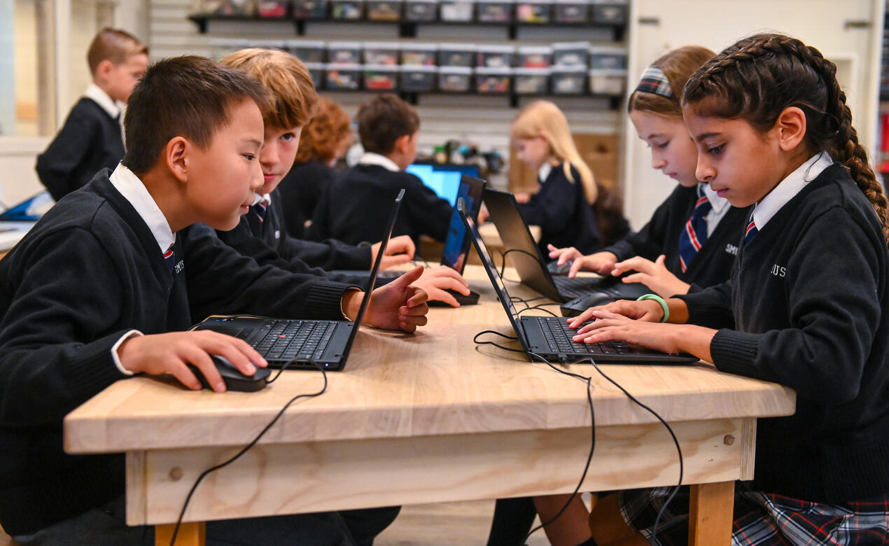 Junior School students on laptops in iLab