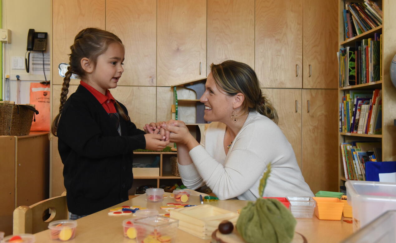 Kindergarten teacher Jean Hollingworth with student