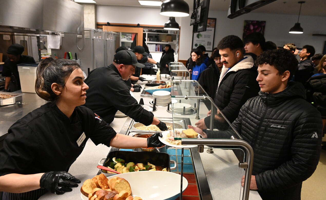 SAGE Dining staff serve food in Graves Hall