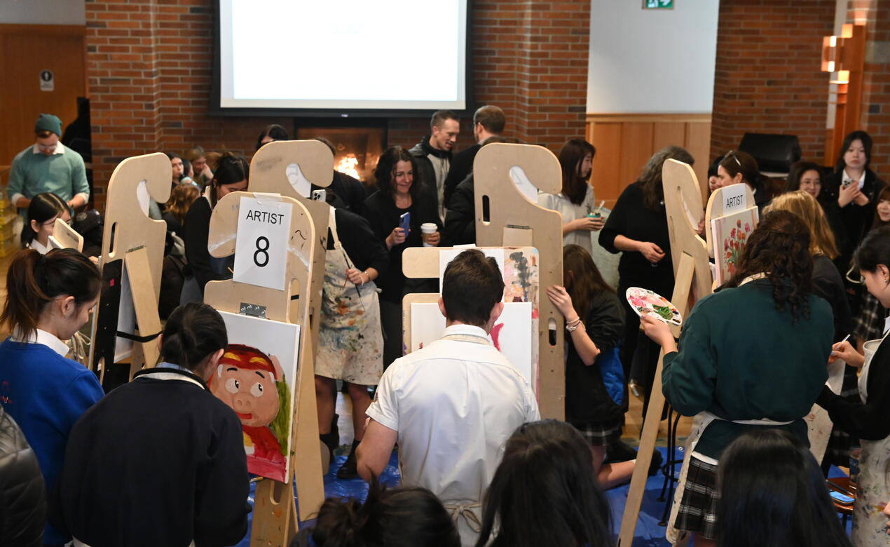 Students participate in a live arts battle, painting for only 20 minutes in support of Coldest Night of the Year fundraising efforts. 
