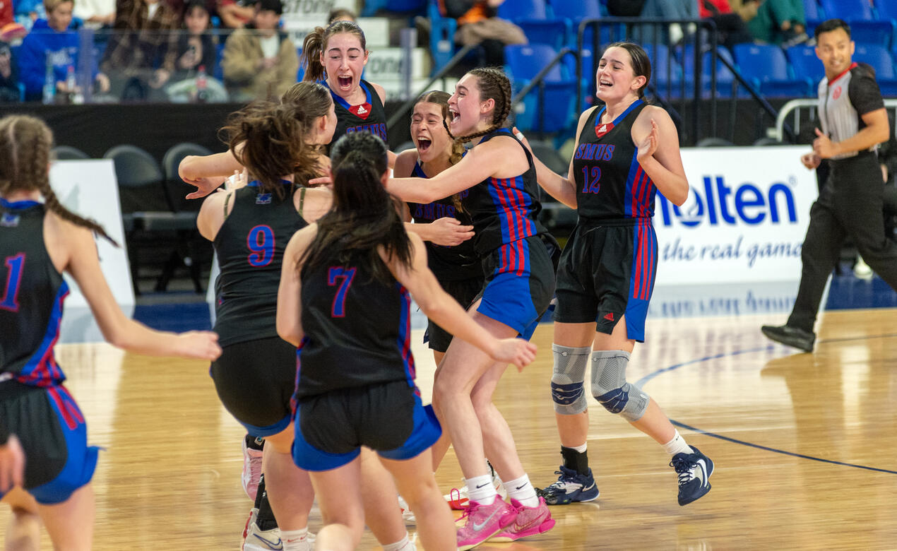 SMUS Senior Girls basketball team celebrate together as BC Champions