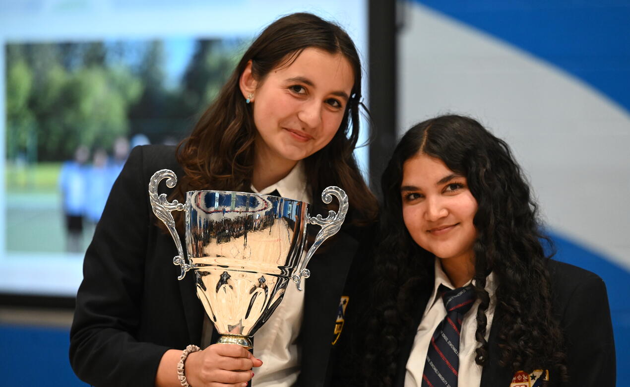 Senior Girls Tennis Captains with trophy at assembly