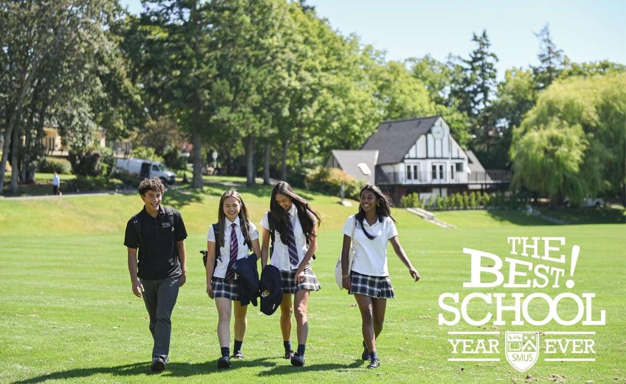 Four students walking on campus