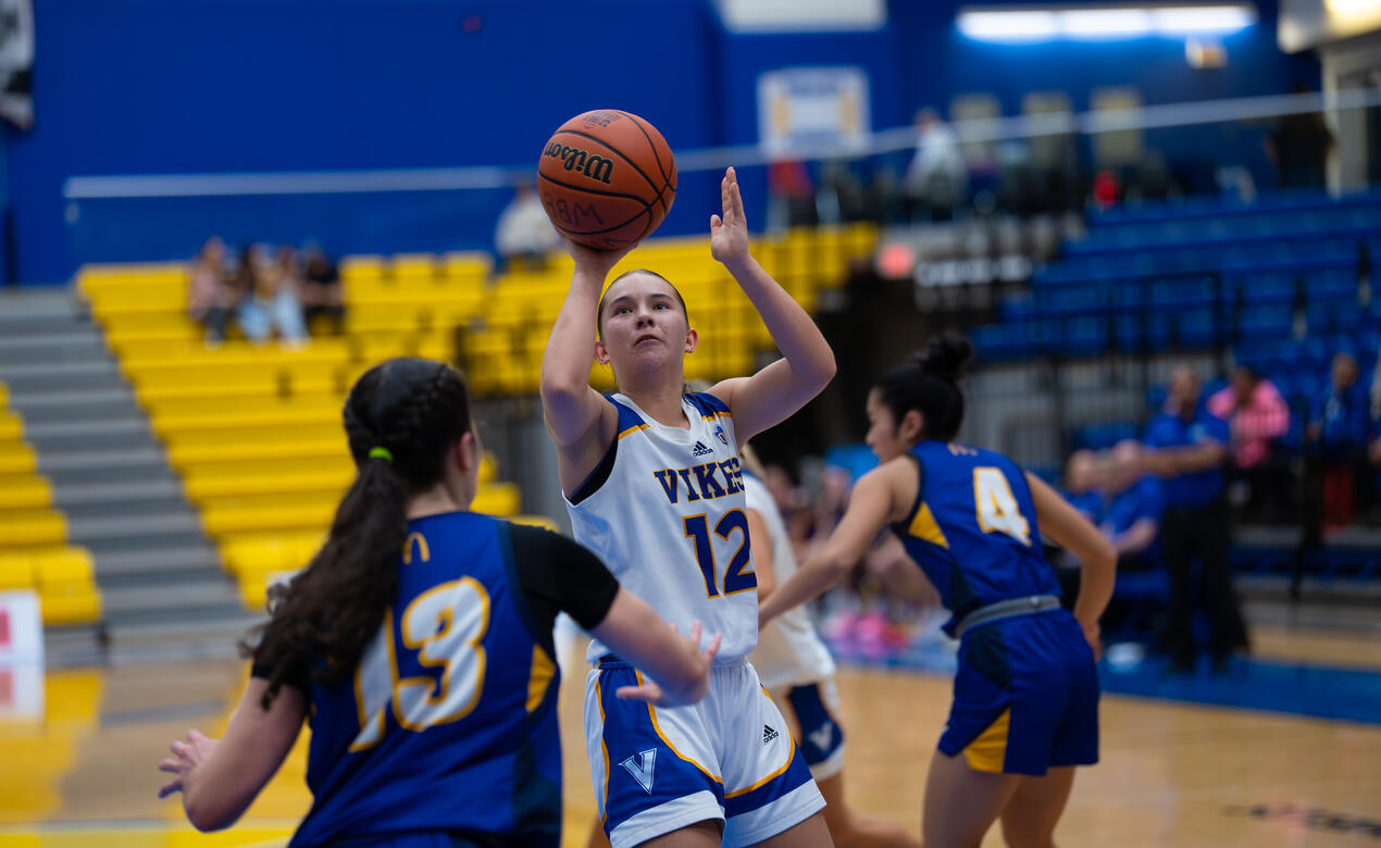 Avery Geddes puts up a jump shop in front of her defender 