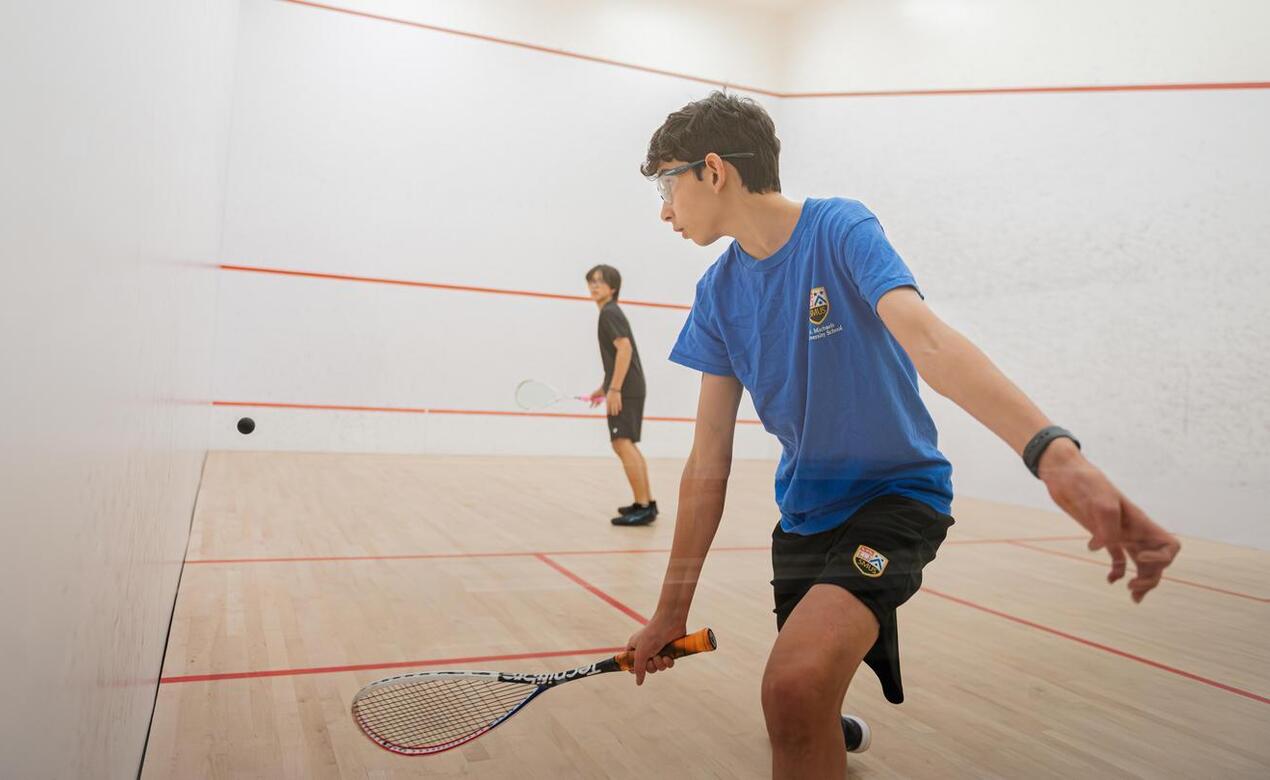 SMUS student Andrew MacEachern playing squash
