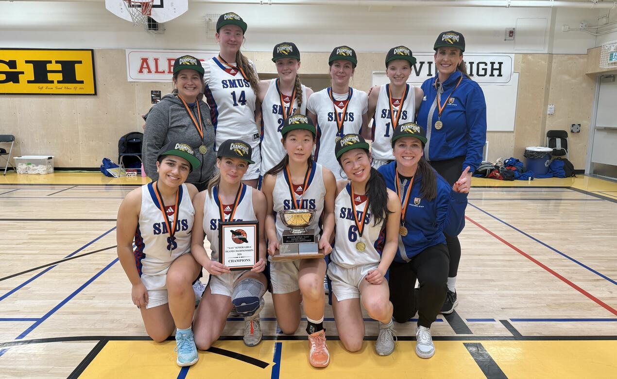 Team photo of the Senior Girls basketball team after winning the AAA Island Championships vs. Isfeld.