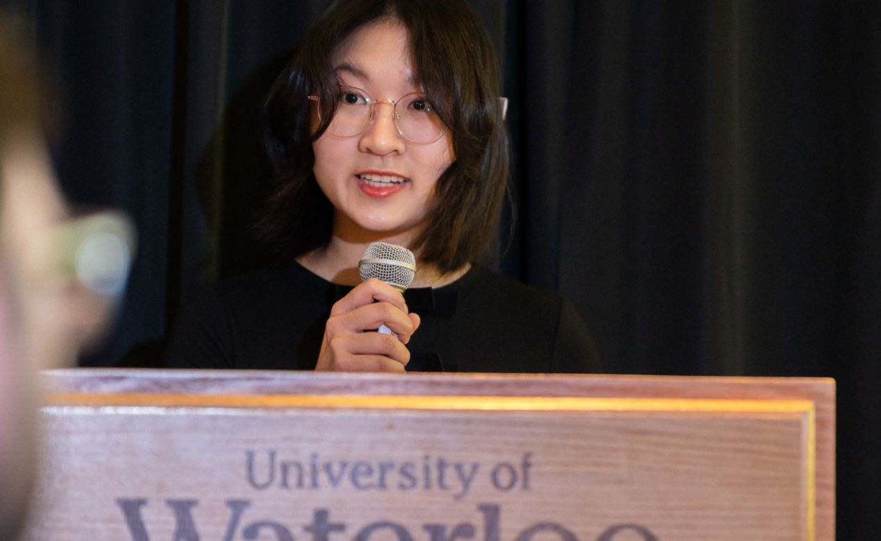 Alumni Giang Tran '23 accepts an award for Co-op Student of the Year at University of Waterloo