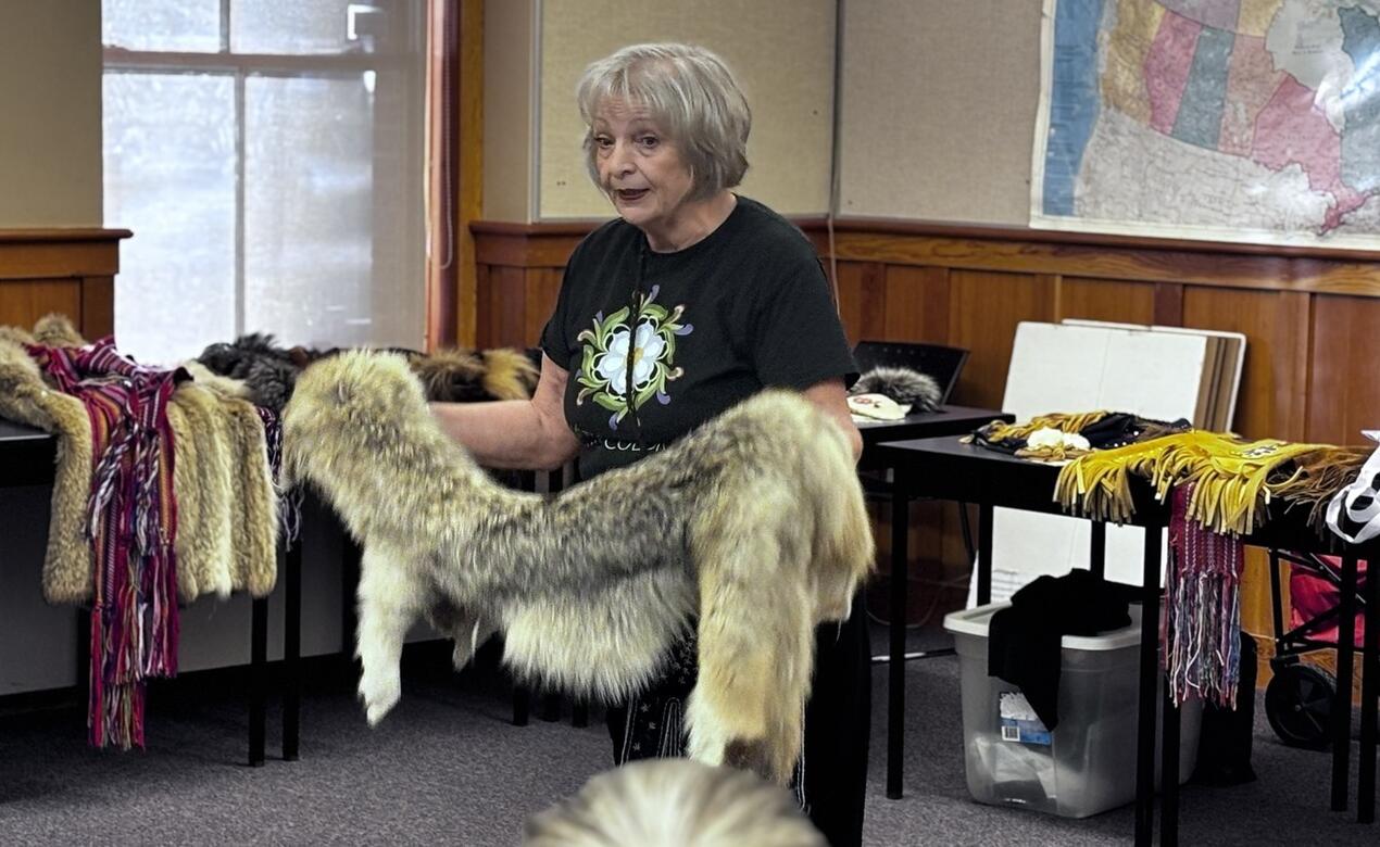 Jo-Ina Young shows pelts to students