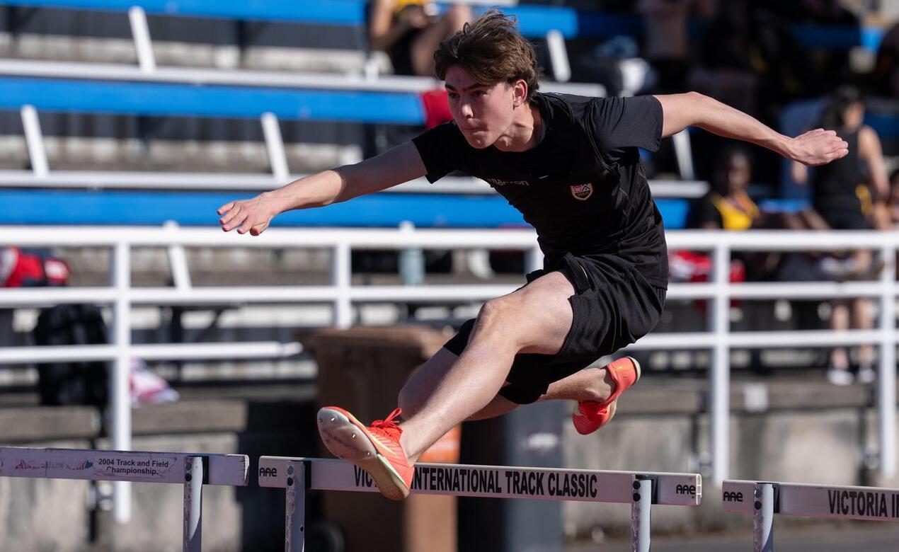 Will Hamilton competes in the hurdles event at Lower Island track and field meet