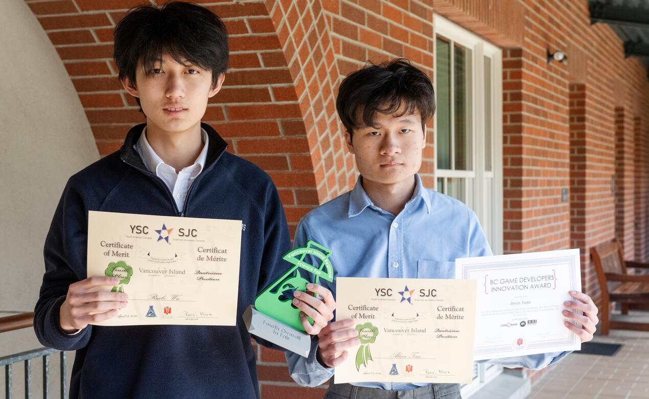 Science Fair participants Alvin Tsao and Ruibo Wu pose with their award certificates