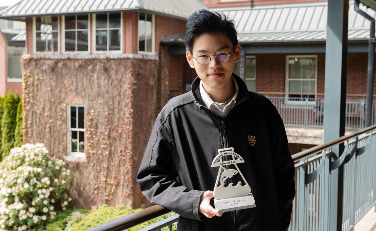 Senior School student George Wang poses with his Science Fair trophy