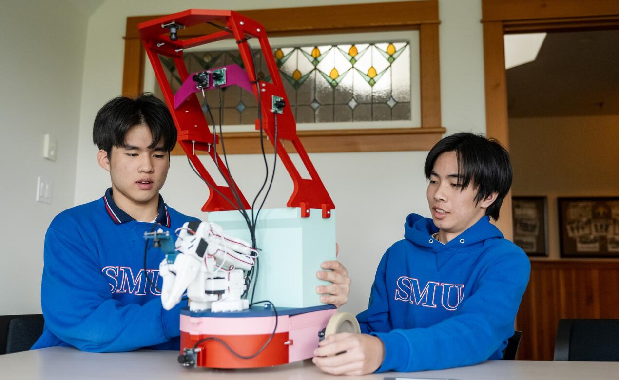 Sting Zhang and Edmond Aphiwetsa show off their Waste-E Science Fair Project