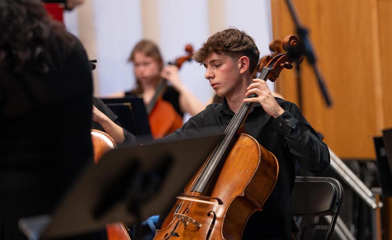 Dominic Ely plays cello in chapel