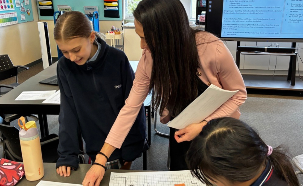 SMUS Middle School teacher Riley Doland with students