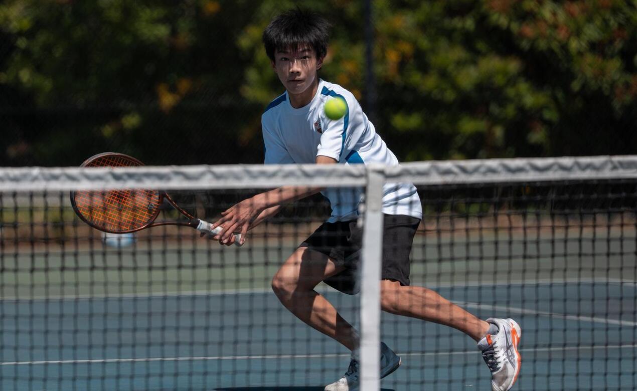 Michael Liu playing tennis