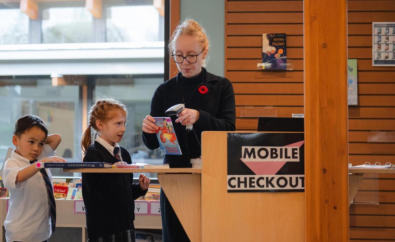 Thea Wilson-Scorgie in the SMUS Junior School library