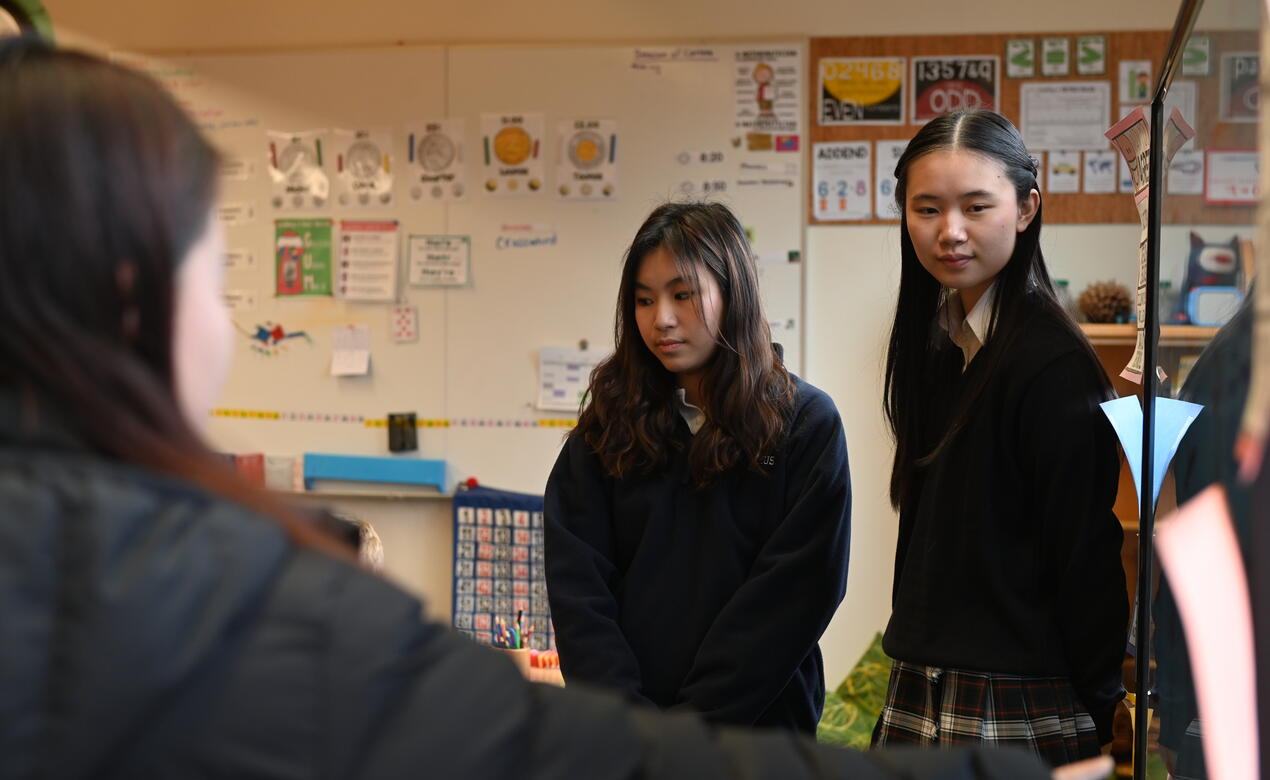 Senior Cindy Chen in a classroom