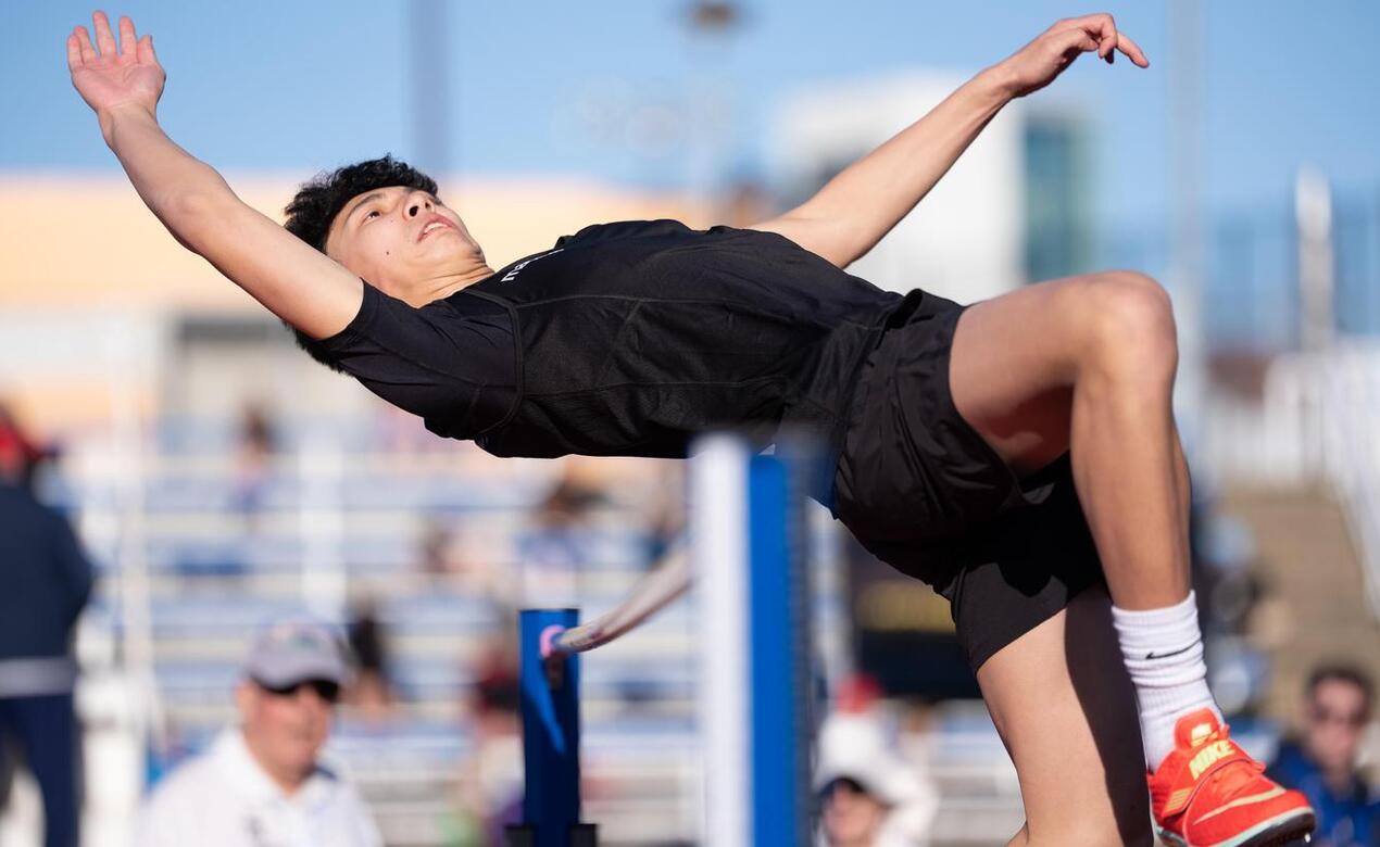 William Low clears the high jump bar