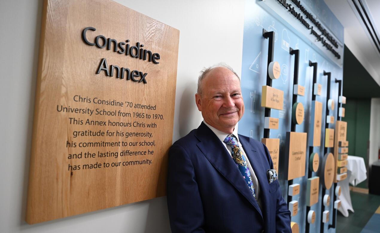 Chris Considine '70 with the Considine Annex plaque