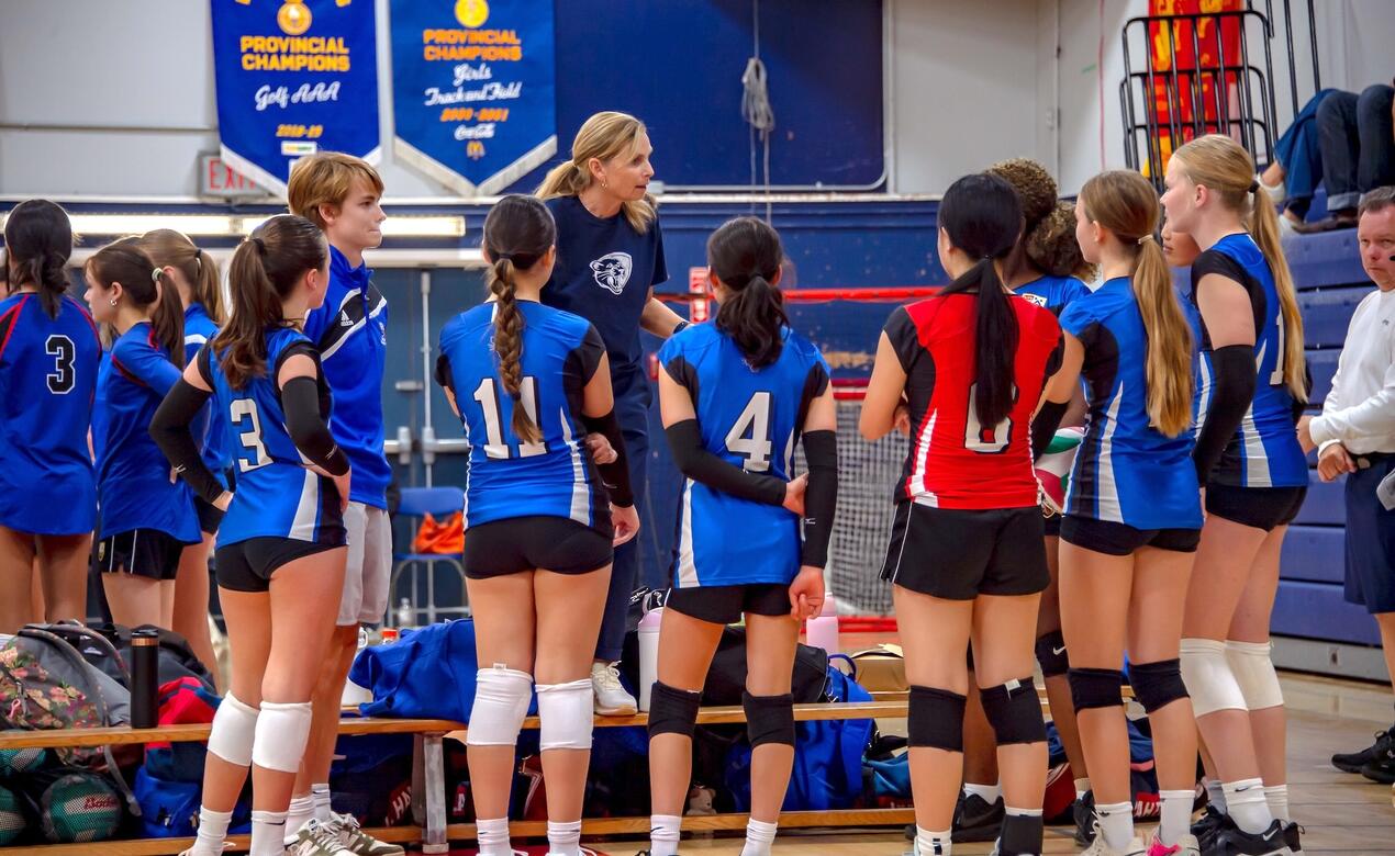 Junior Girls Volleyball team huddle