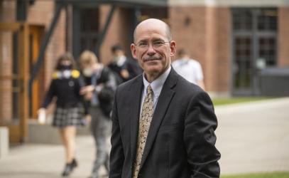 Photo of Andy Rodford in the Quad with students in the background