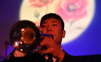 Student playing the trumpet on Remembrance Day
