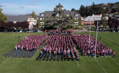 The whole school gathers on the Richmond campus field for the Jubilee ceremony