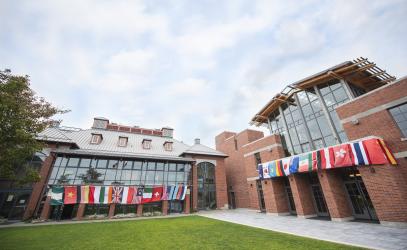 Country flags hanging from Schaffter and Sun Centre buildings