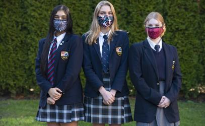 Three students pose for a photo