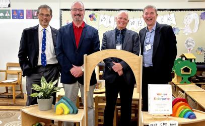 A group of St. Michael's School Old Boys pose for a photo in the current Kindergarten classroom at the Junior School