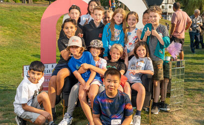 A group of Junior School students pose at the photobooth during the Junior School Welcome Barbecue