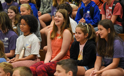 A group of new Middle School students smile during the WEB Welcome event on the first day of school