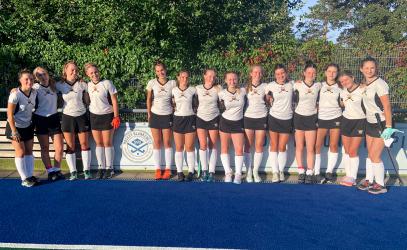 The Senior Girls Field Hockey team poses for a photo after a game in Germany