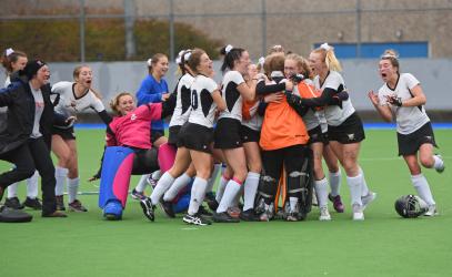 Members of the Senior Girls Field Hockey team celebrate an emotional Provincial win