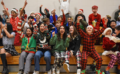 A crowd of students cheer during Middle School Reindeer Games