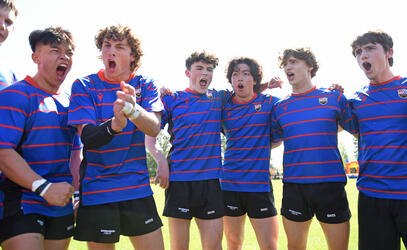 The Senior Boys Rugby team cheers ahead of the Alumni Weekend 2023 game