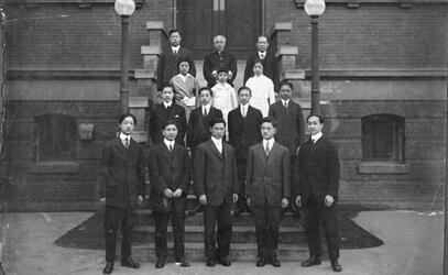 Students and staff stand in front of the Chinese Public School